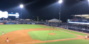 A Group Of Baseball Players Standing Next To Home Plate
