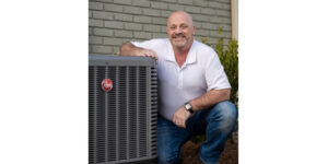 A Man Standing In Front Of A Building