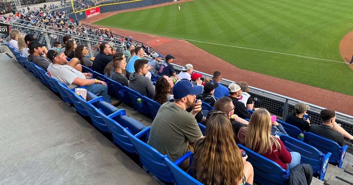 a group of people sitting in chairs in front of a crowd a group of people sitting in chairs in front of a crowd