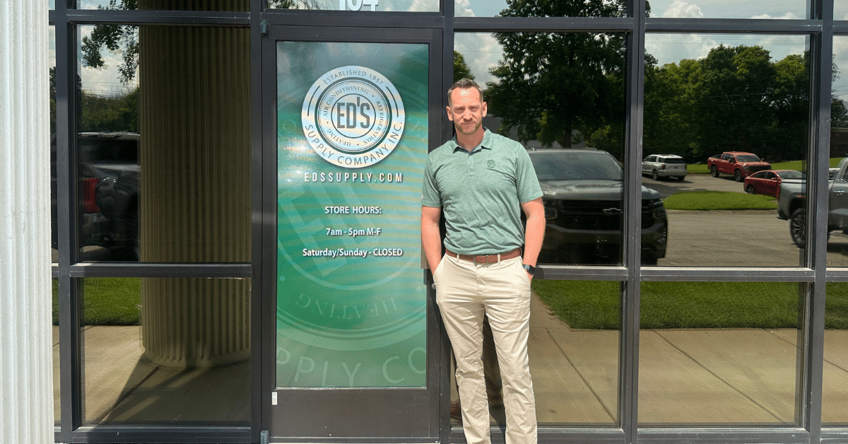 a person standing in front of a sign