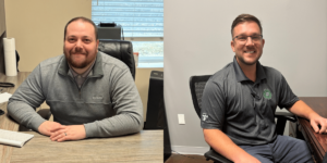 A Group Of People Sitting At A Table